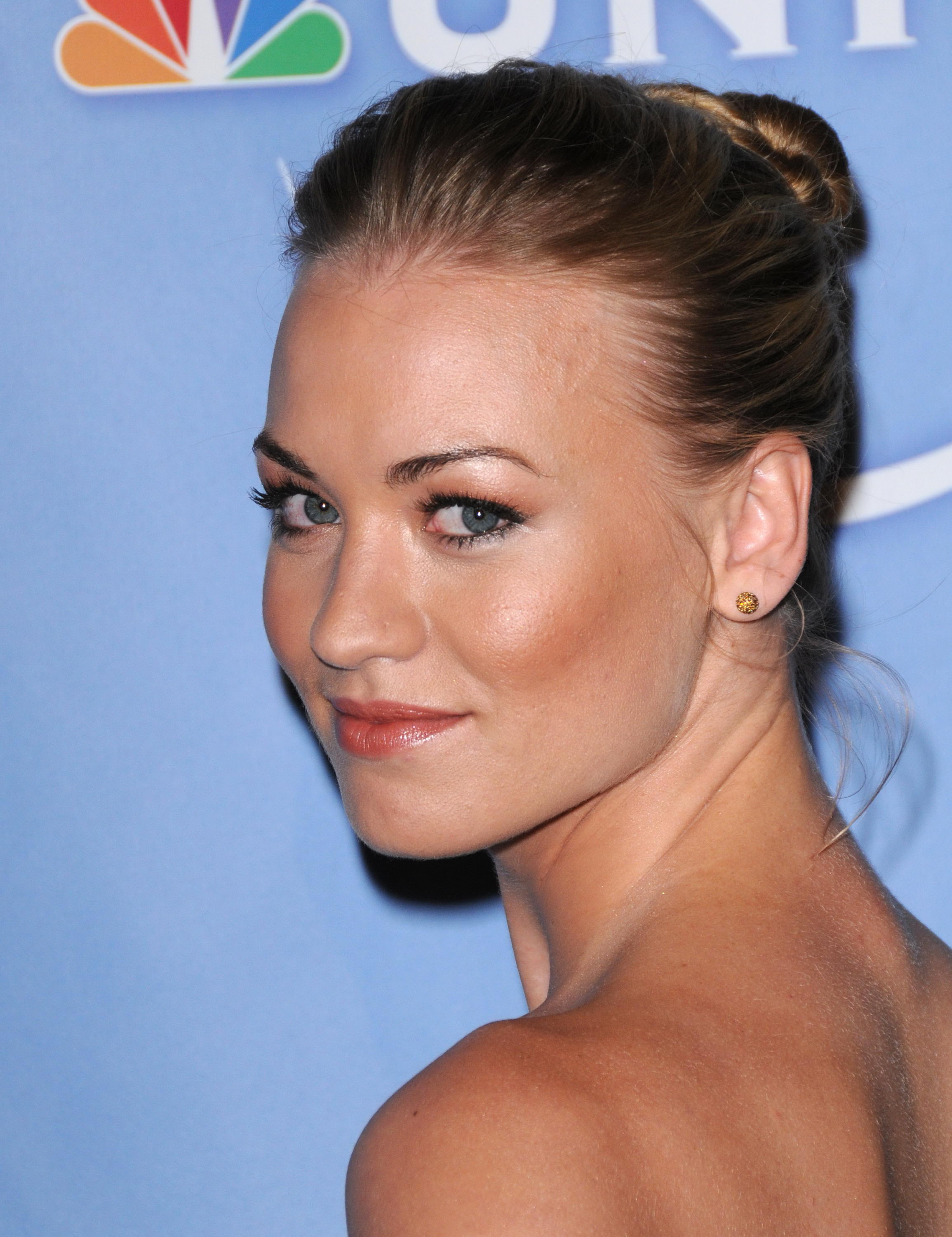 Yvonne Strahovski  looking over her shoulder at NBC cocktail party