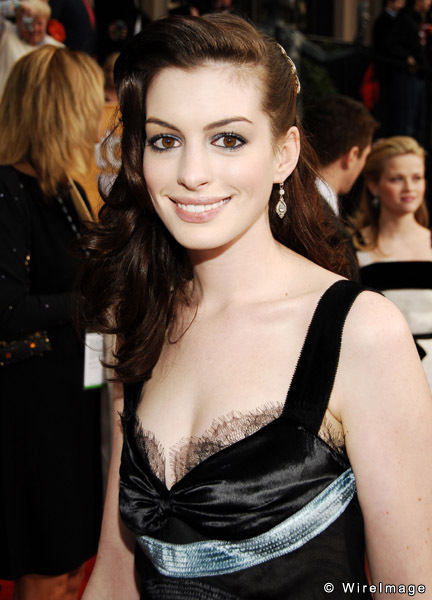 Anne Hathaway in black evening gown with silver accent