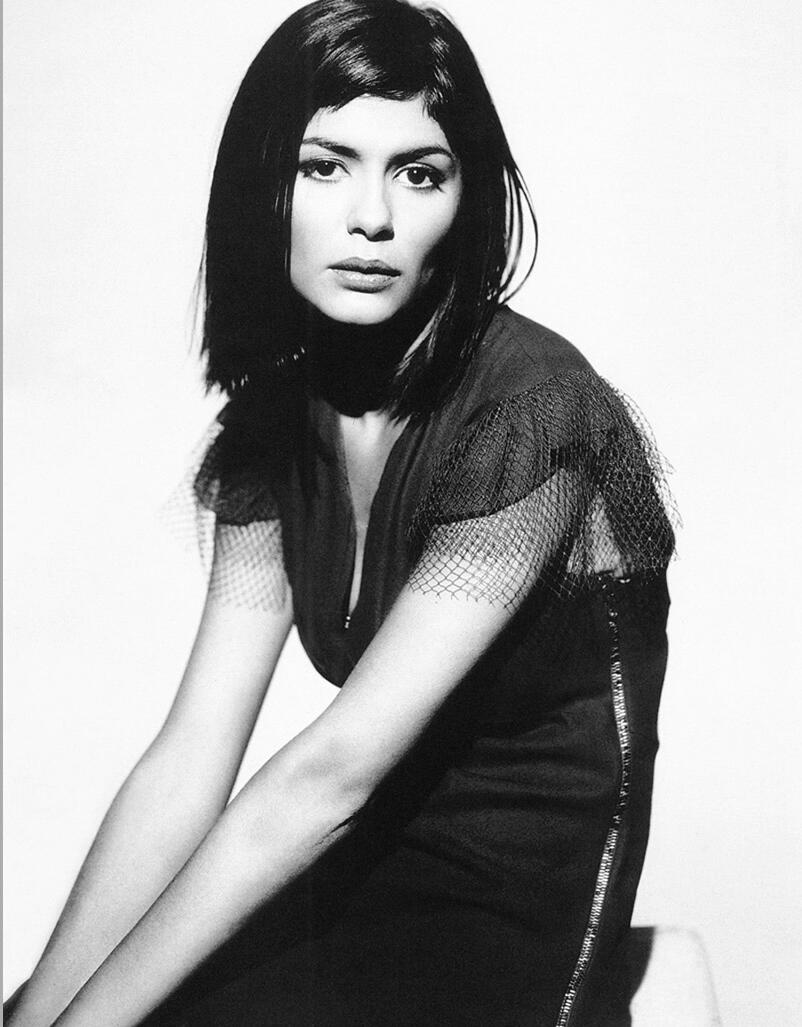 Audrey Tautou looking sad in a black dress