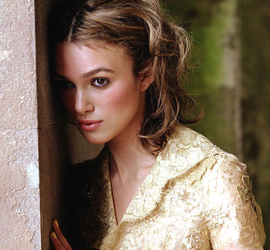 Keira Knightly looks shy in cream colored lace