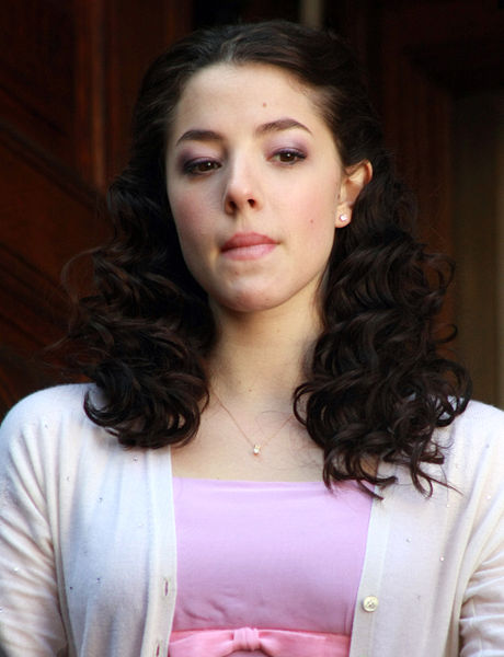 Olivia Thirlby in pink dress with white sweater