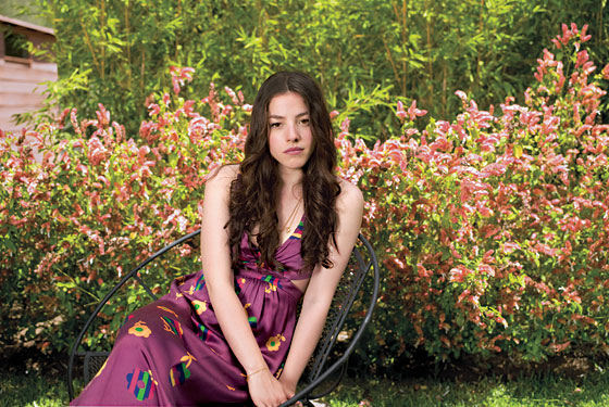 Olivia Thirlby give an interview in fucshia print dress