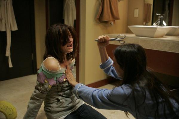 Hayley Bennett getting stabbed in The Haunting of Molly Hartley