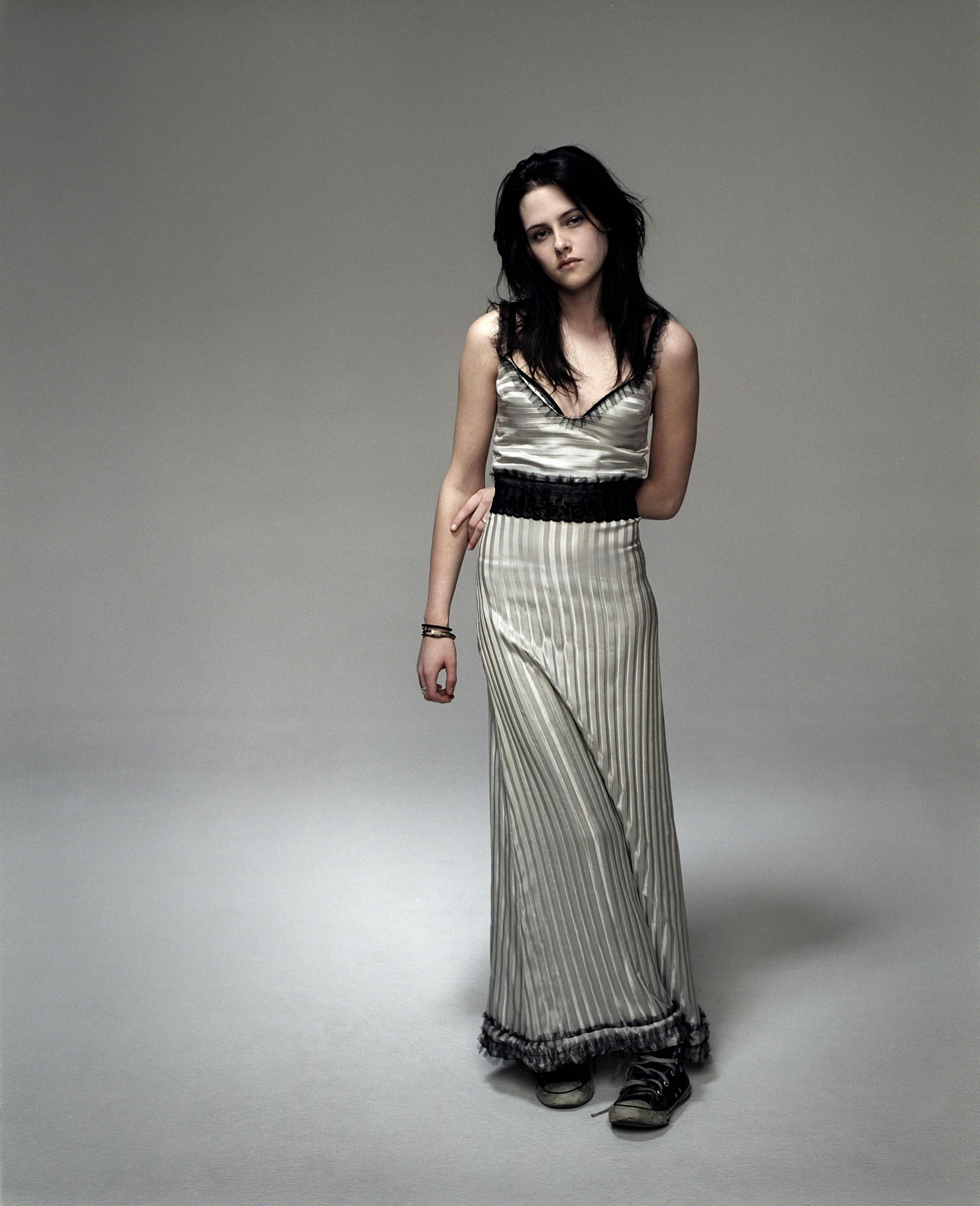Kristen Stewart in grey floor length gown and sneakers